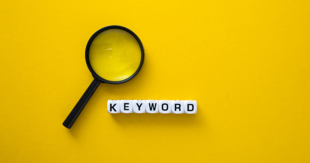 Image on a yellow background with a magnifying glass and the word "Keyword" in block letters